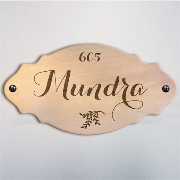 Wood is perfect for a house name plate.