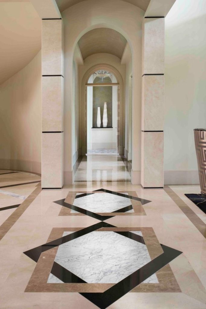 Geometric marble flooring adds depth to the room.