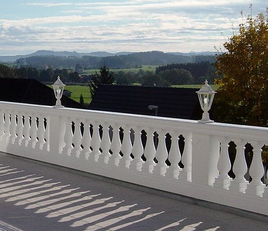 White parapet wall carved