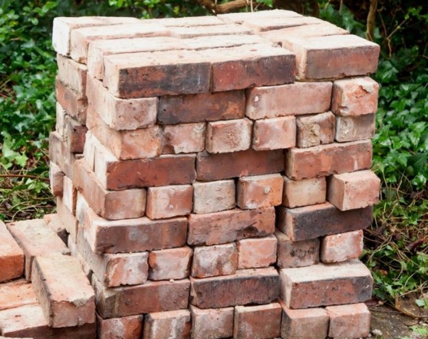 this is an image of bricks stacked over each other | Construction cost of 1 kanal house