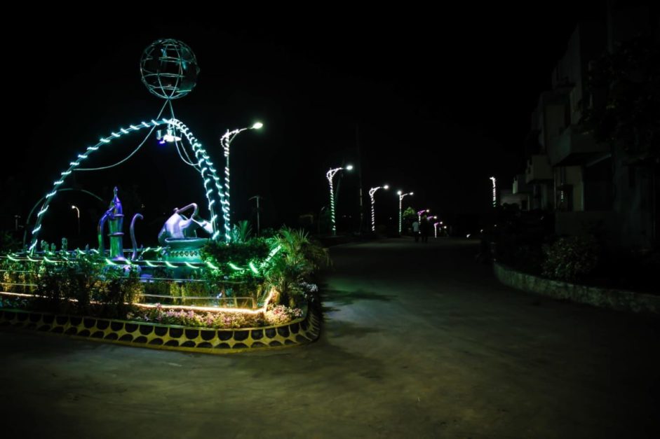 foutain decorated with green lights at adyala road