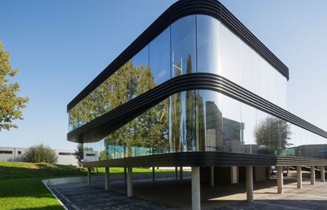 A curved glass facade building