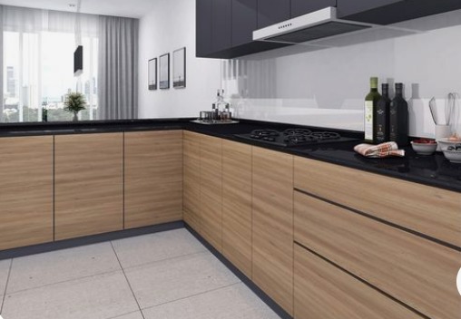 Laminate cabinets of light brown colour with black countertops