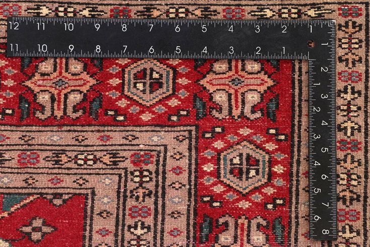 a traditional persian carpet with intricate pattern