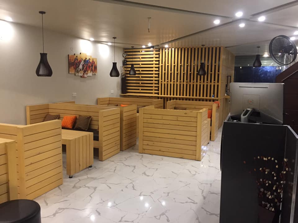 Mate's cafe in faisalabad designed with wooden seating