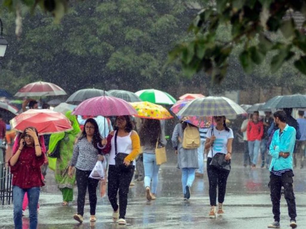 Women carrying umbrellas during rain