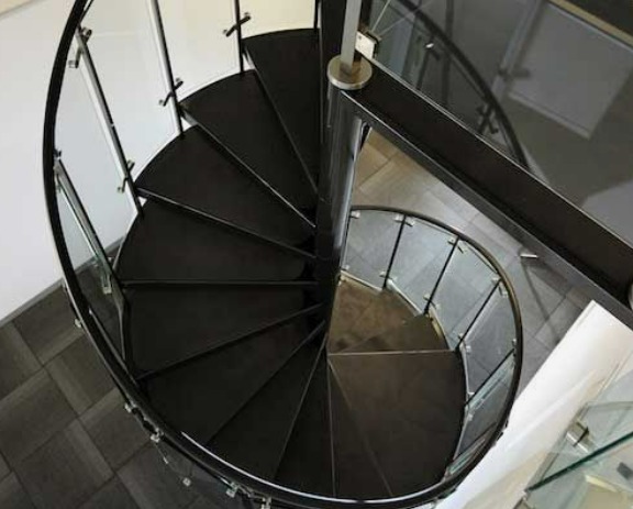 curved steel railing of indoor stairs