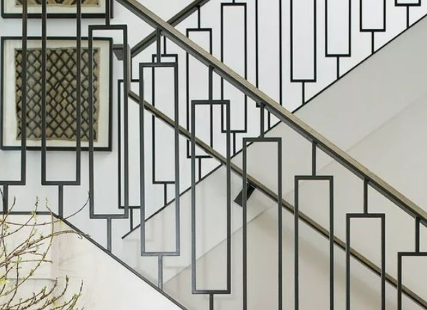 Geometric patterned stainless steel railing design of a house's stairs