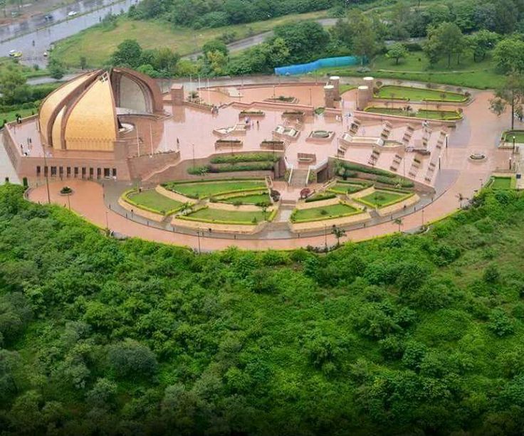 aerial vie of pakistan monument surrounded by greens in the evening