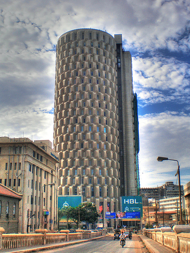 A day view of Habib Bank Plaza with sky covered in dense clouds