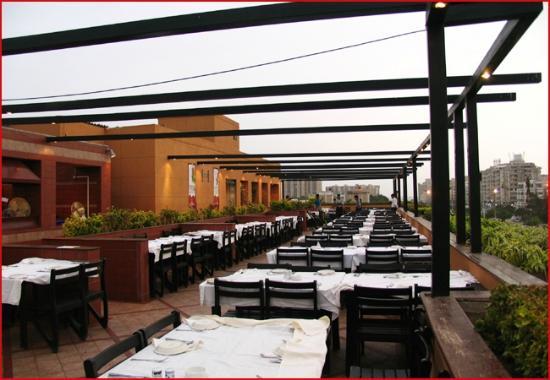 dining tables and chairs at bar bq restaurant in Karachi