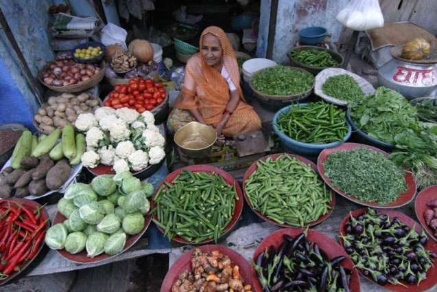 Lady selling Vegetables at Sabzi Mandi Karachi