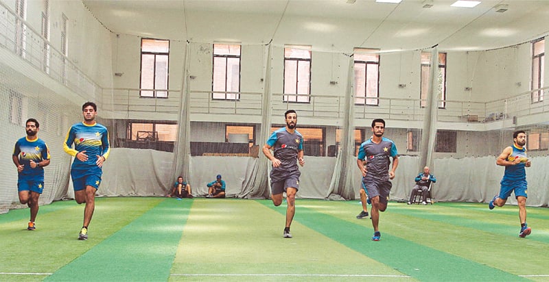 Pakistani cricket player practicing and running in an academy