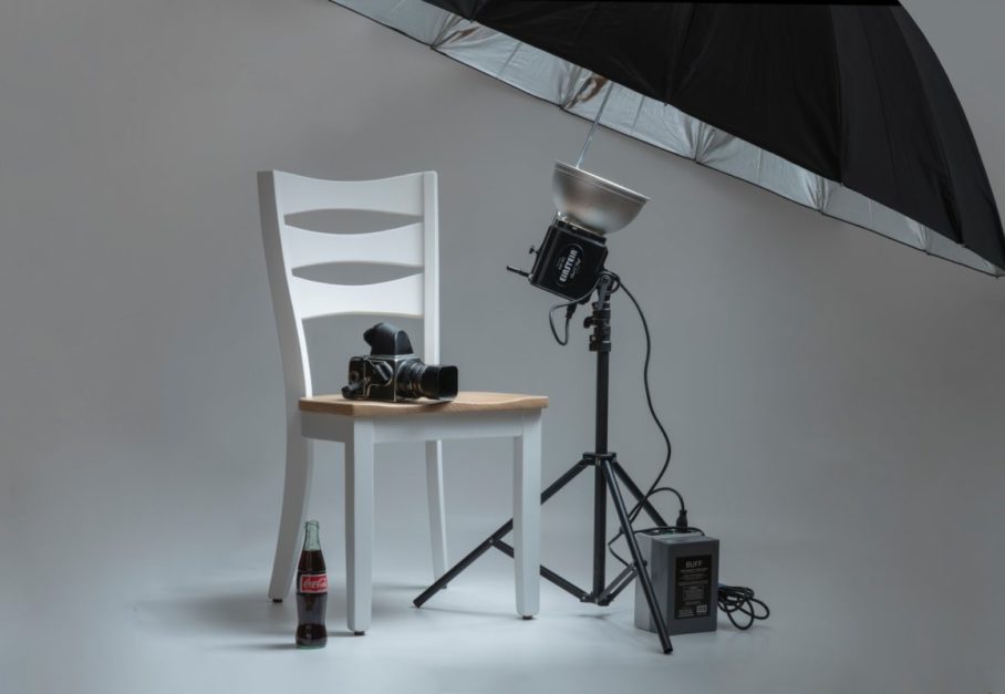 camera on a chair in home photography studio