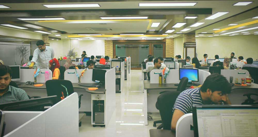 Employees working in a cornand Labs