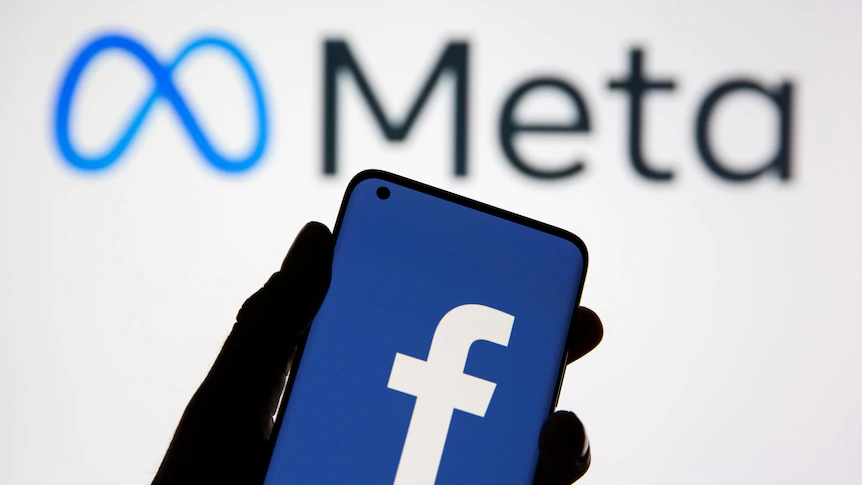 facebook logo on the phone with meta logo on the back