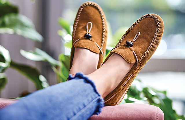 a girl wearing brown loafers from popular shoe brand in pakistan